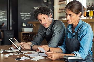 Man and Woman looking at bills or tax Thumb 360 x 240